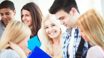 Group of students standing in group with registeration materials